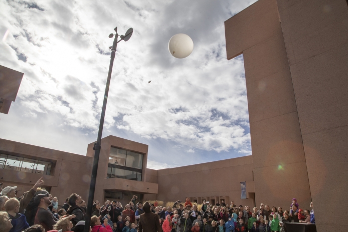 A crowd watched the launch of a weather balloon at the NCAR Mesa Lab