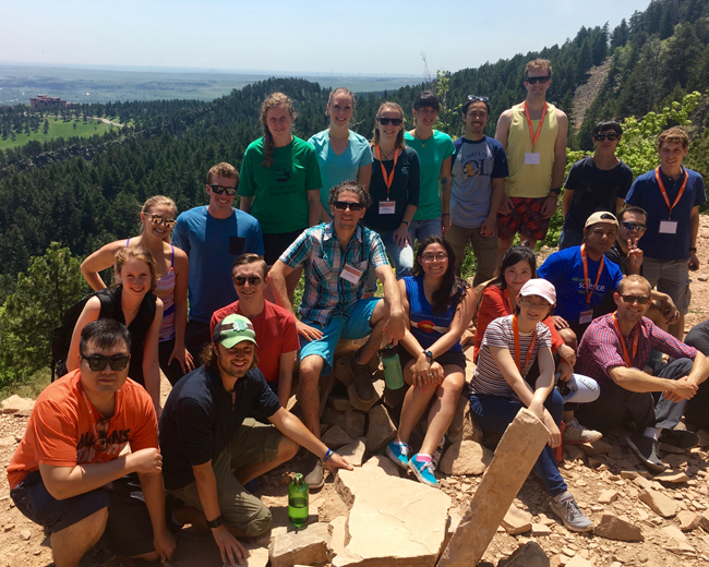 Group photo from colloquium hike with NCAR in the background