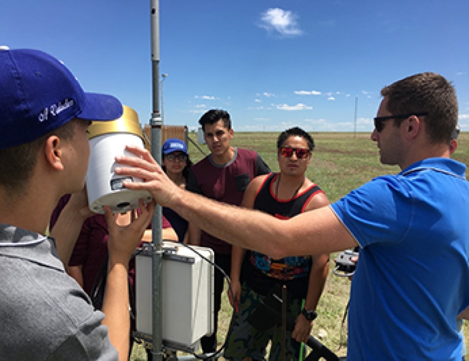 Interns interact with their mentor in the field