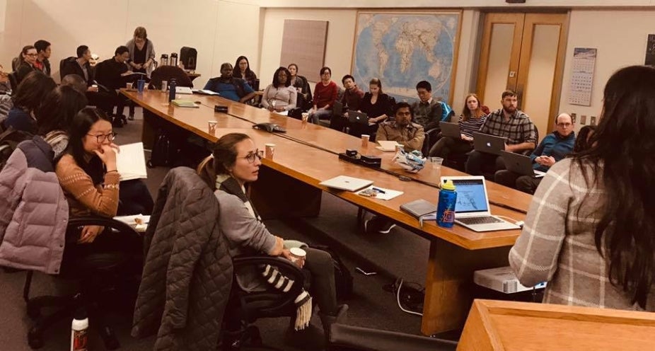 Postdocs listening to a professional development workshop