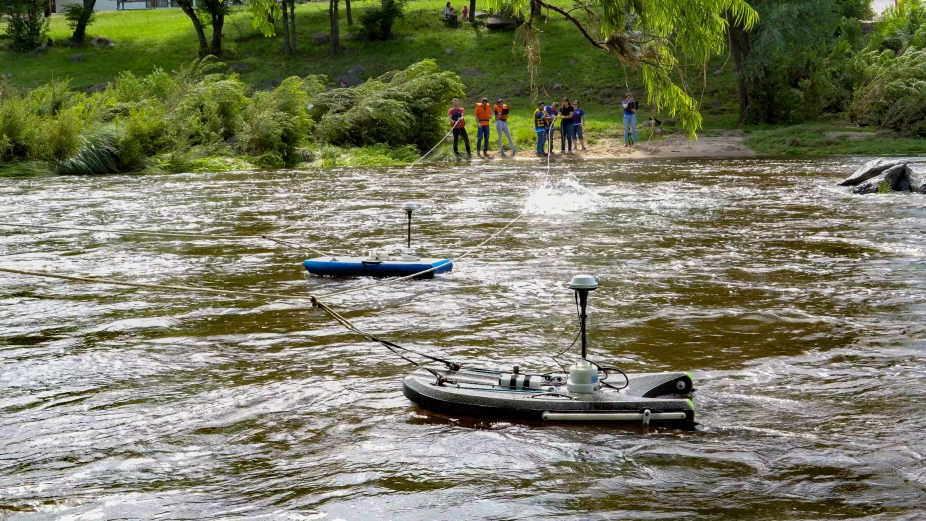 Students measure river flow with floating instruments