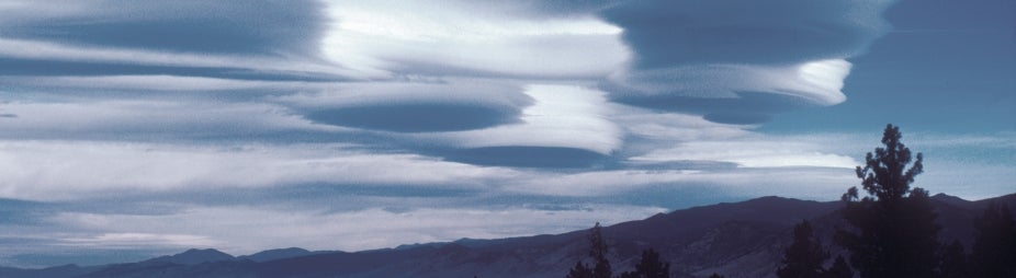 Lenticular, or lee wave, clouds form downwind from an obstacle in the path of a strong air current. In the Boulder, Colorado, area, the obstacle is the Front Range of the Rocky Mountains. Lenticular clouds can often be seen along the lee side of the range.