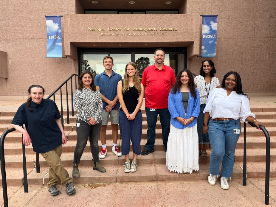 Group photo of the 2024 NESSI Interns on the steps of the NSF NCAR Mesa Laboratory