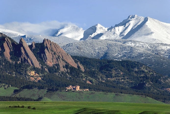 Mountain vista with a building in the foreground