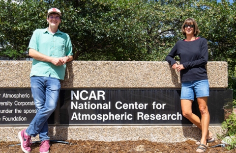 Two GVP Participants in front of NCAR sign