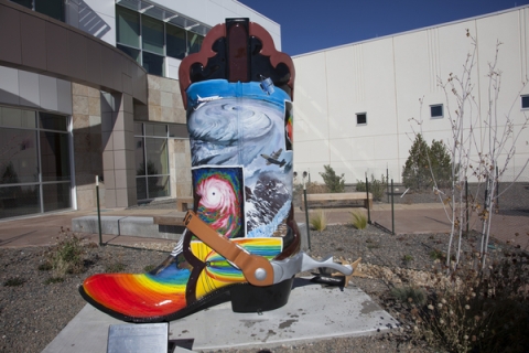 Cowboy boot decorated with meteorological images