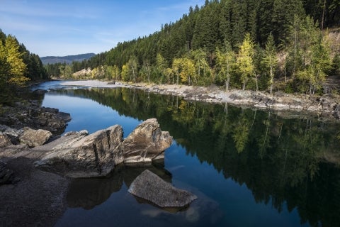 A river passes through a forested valley
