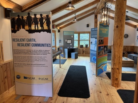 A series of exhibit content panels displayed in a community center