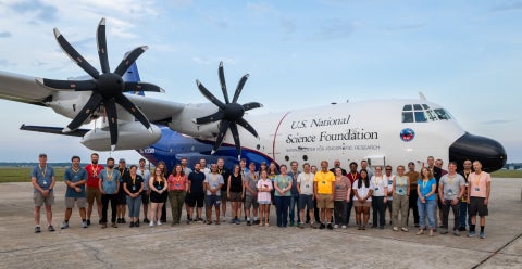 The GOTHAAM team stands in front of the NSF NCAR C-130 research aircraft