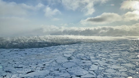 Clouds forming over an icy ocean