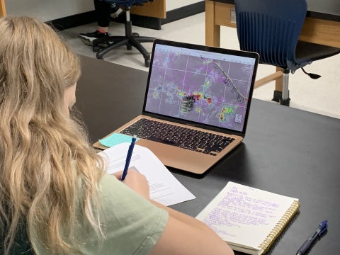 A university student uses NSF NCAR data during a classroom activity.