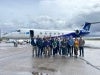 The crew of ACES 2024 stand in front of the GV aircraft 